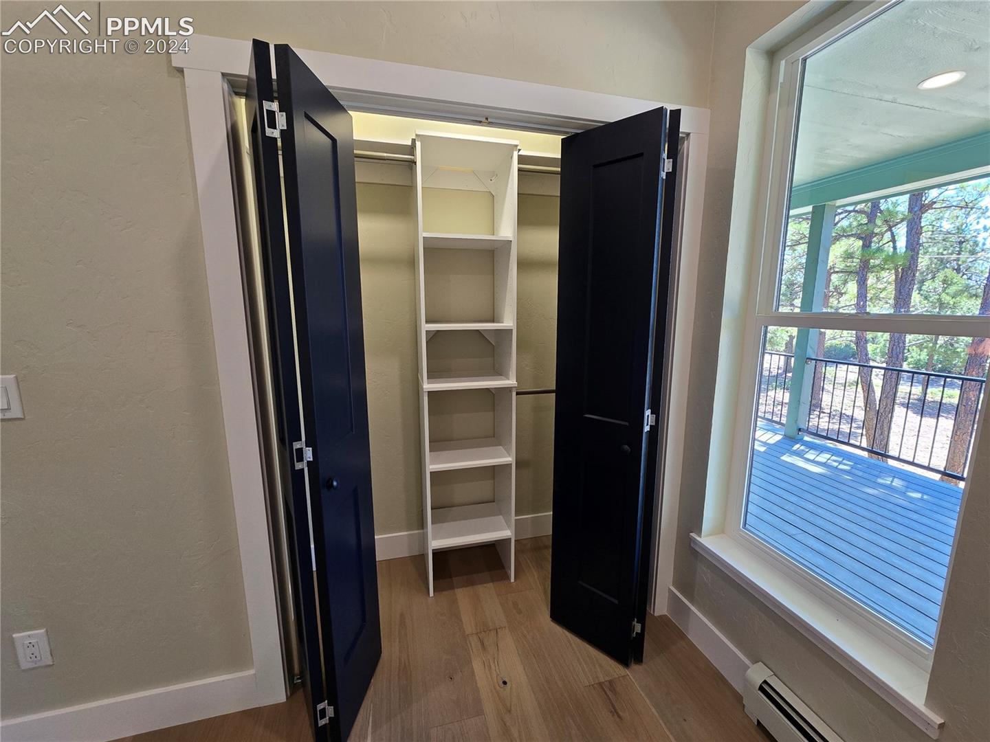 Closet with a baseboard heating unit