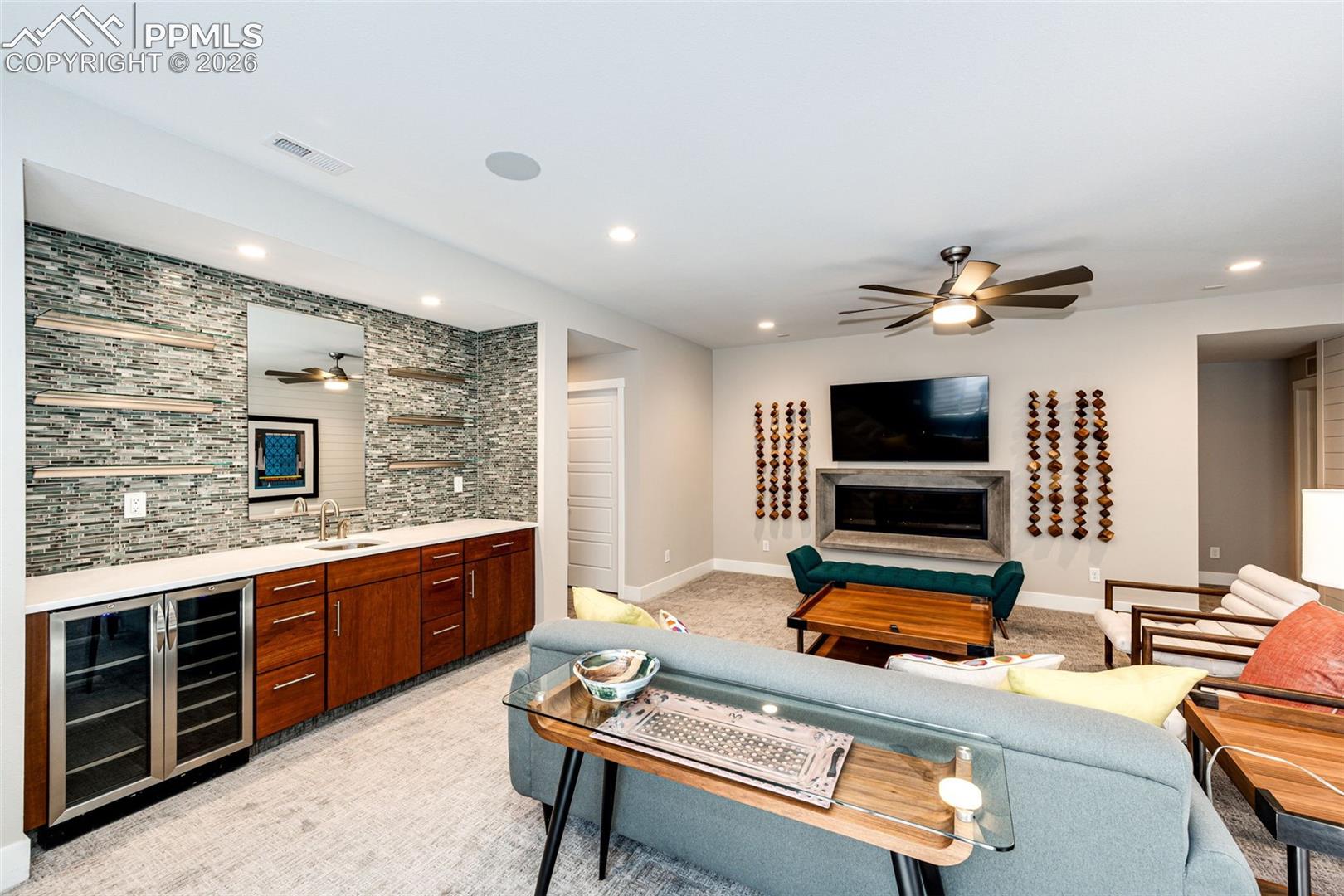 Downstairs Rec Room wet bar with beverage refrigerators and fireplace. Remember, all this furniture is negotiable!
