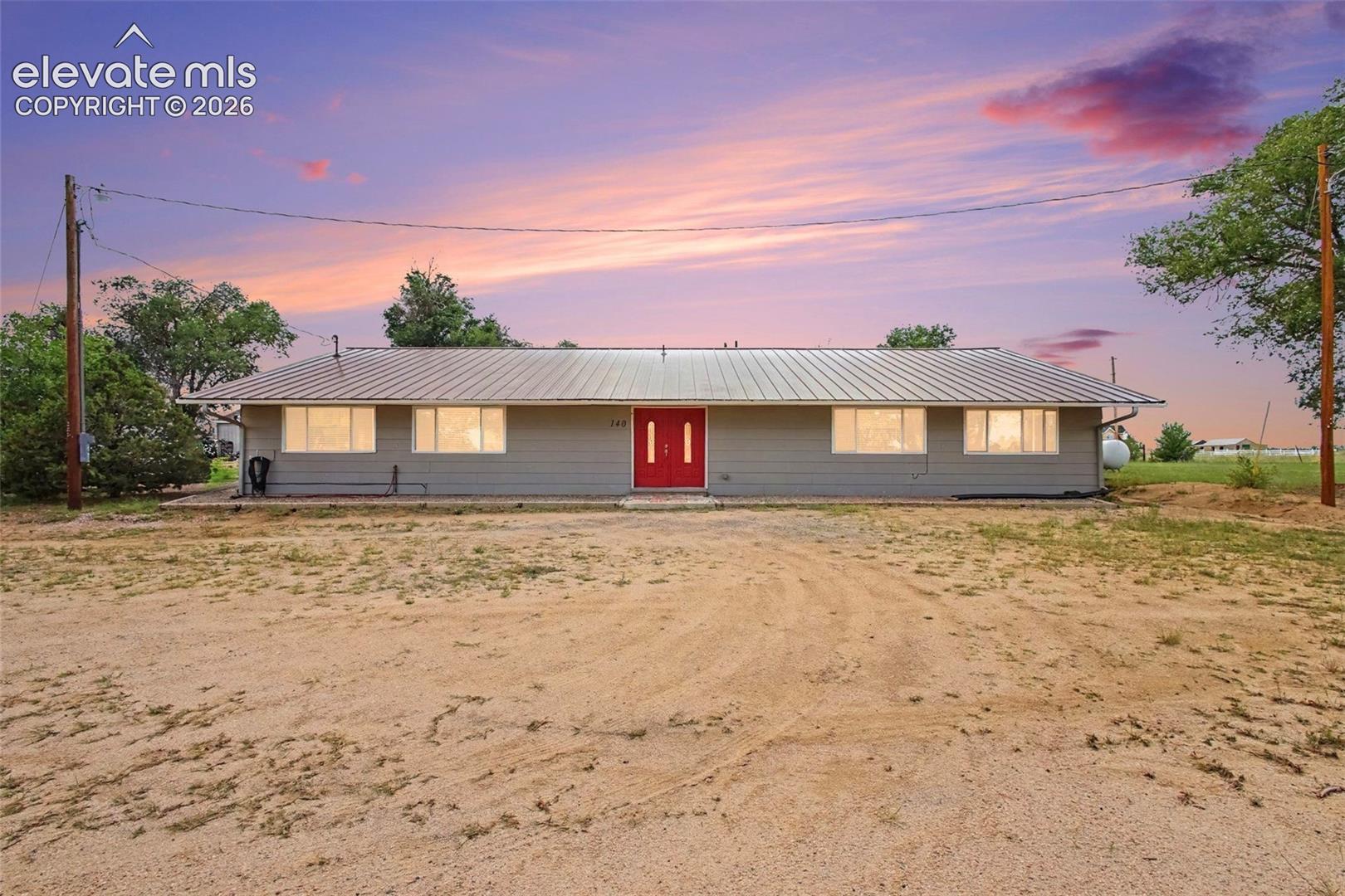 Beautiful ranch-style home with a welcoming front entry with an  abundance of parking.