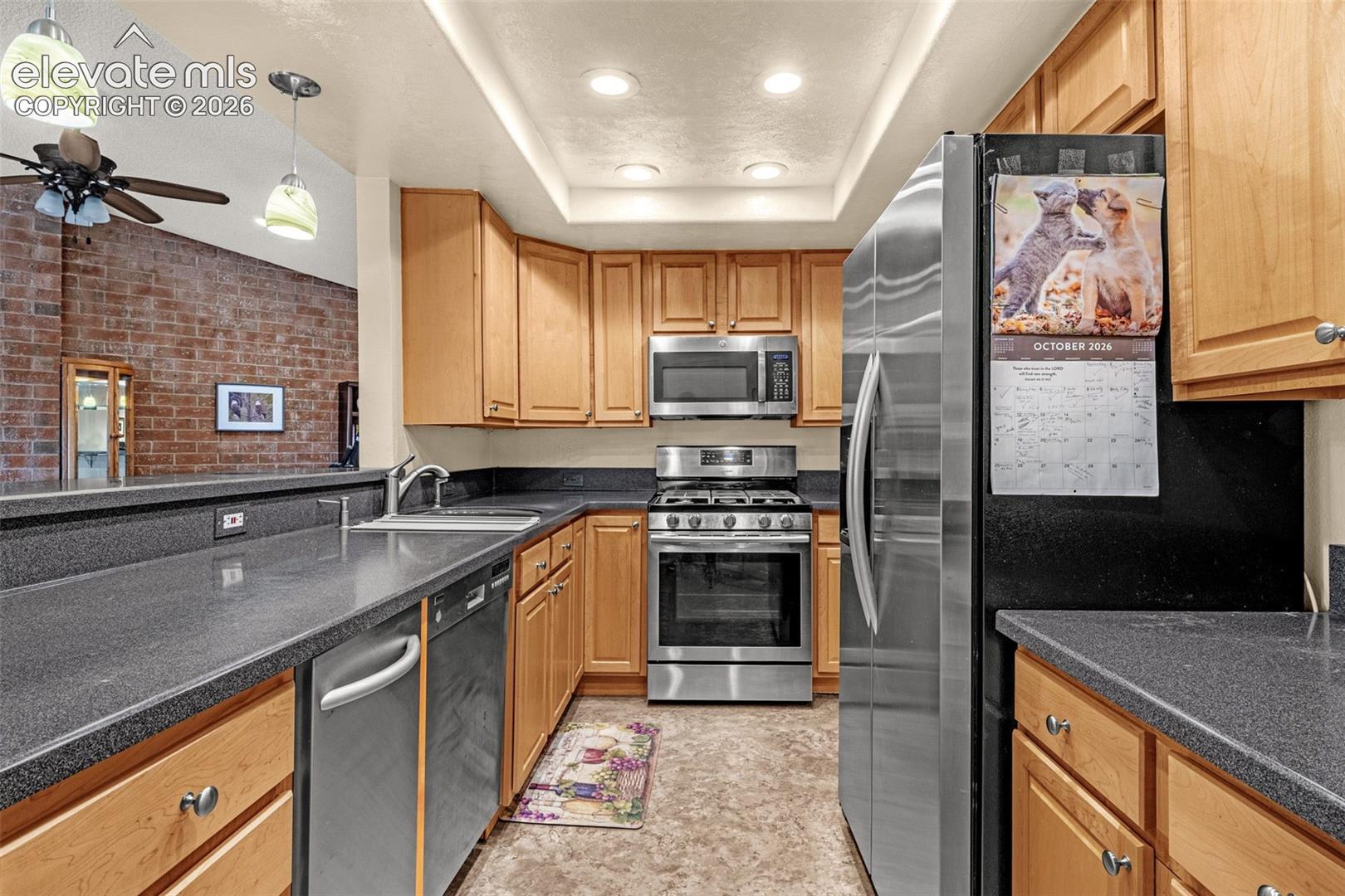Bright recessed lighting! Laundry room next to kitchen