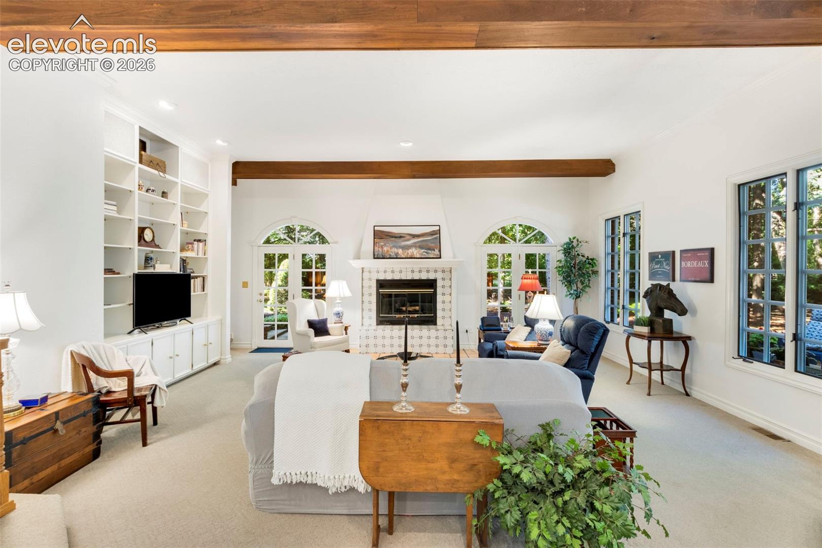 Step down Family room with fireplace and builtins