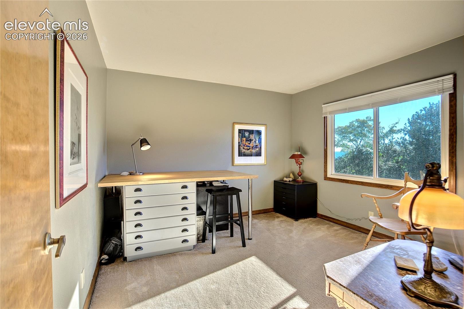 Natural light + generous proportions continue throughout the home's upper-level bedrooms.