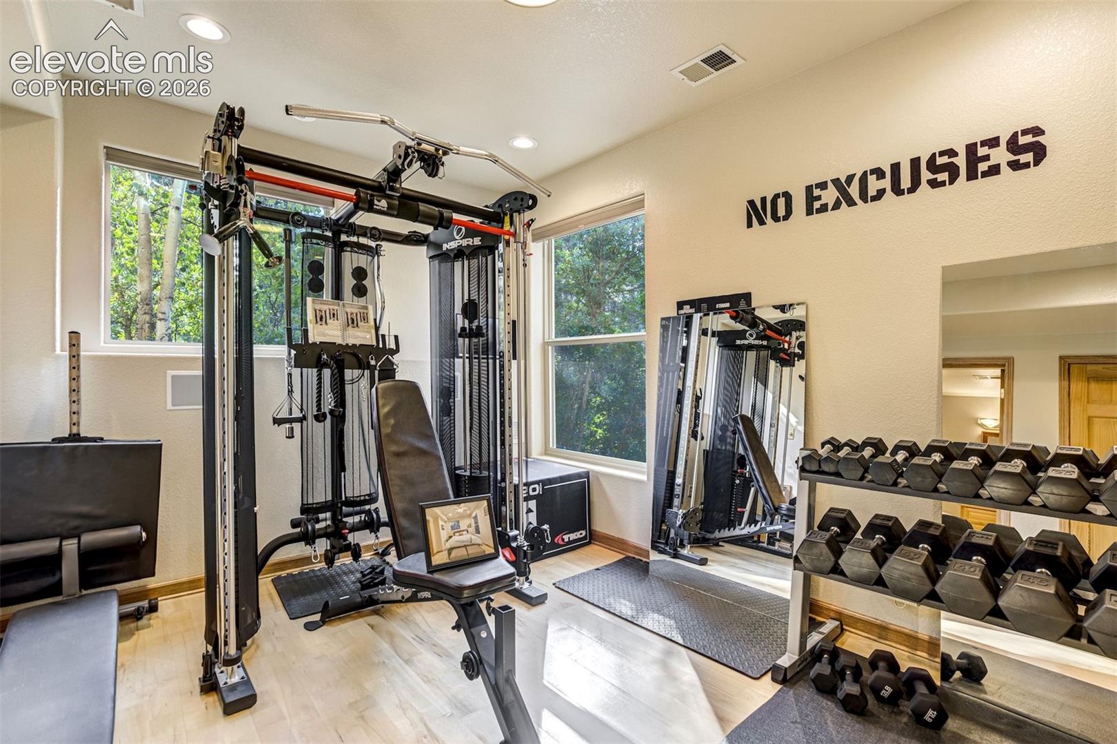 Spacious basement bedroom or bonus room with recessed lighting and light wood-finish flooring