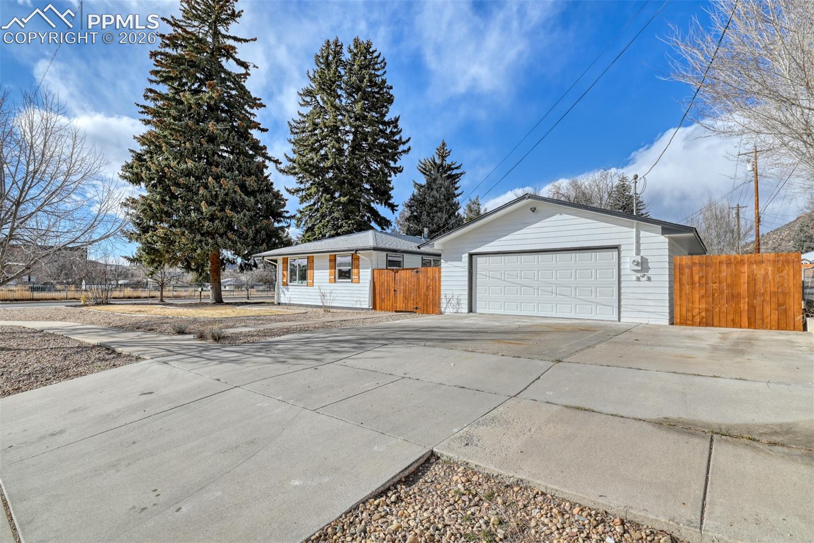 View of home's exterior with concrete driveway