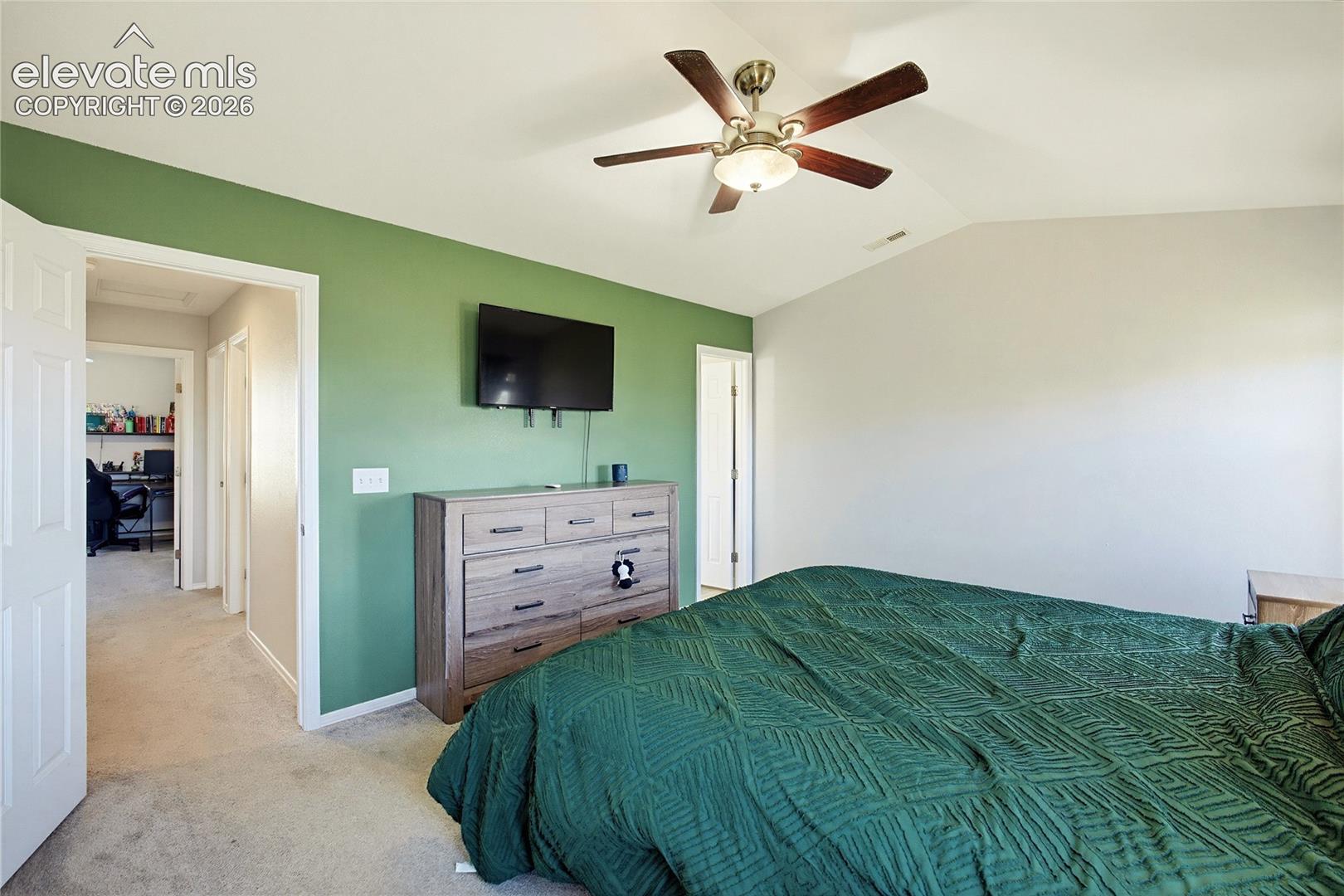 Vaulted ceiling with an attached ceiling fan
