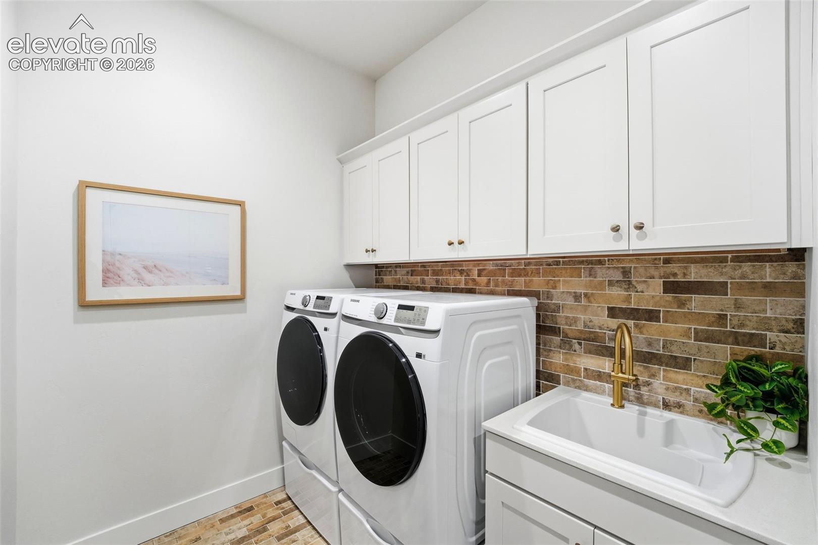 Laundry Room with access off the Primary Closet