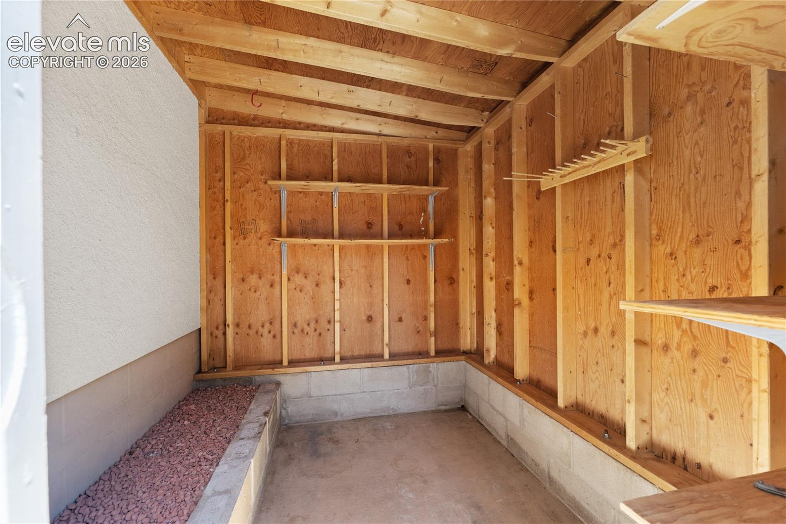 Storage shed behind the garage plenty of room for yard tools