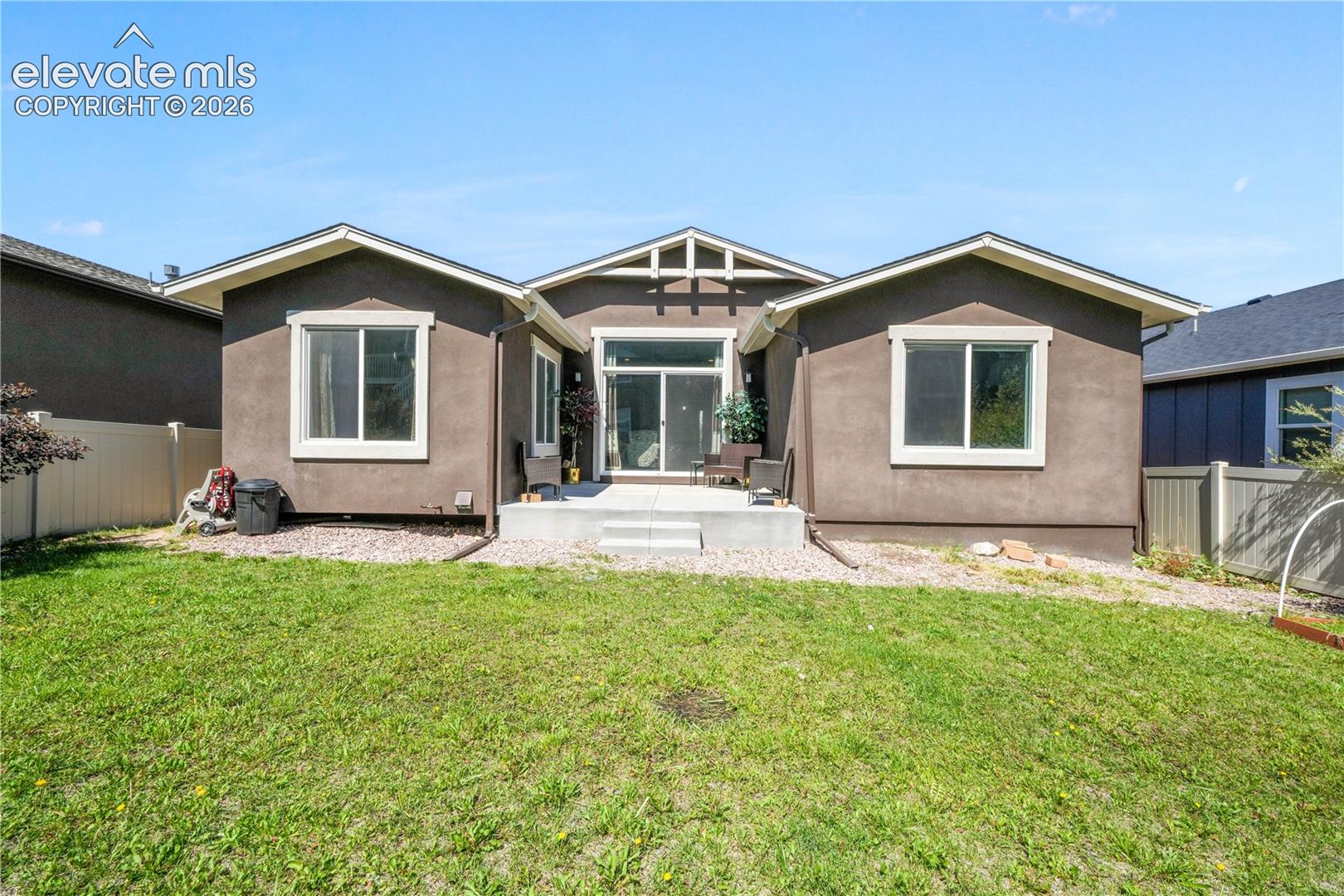 Back of home, patio and landscaping