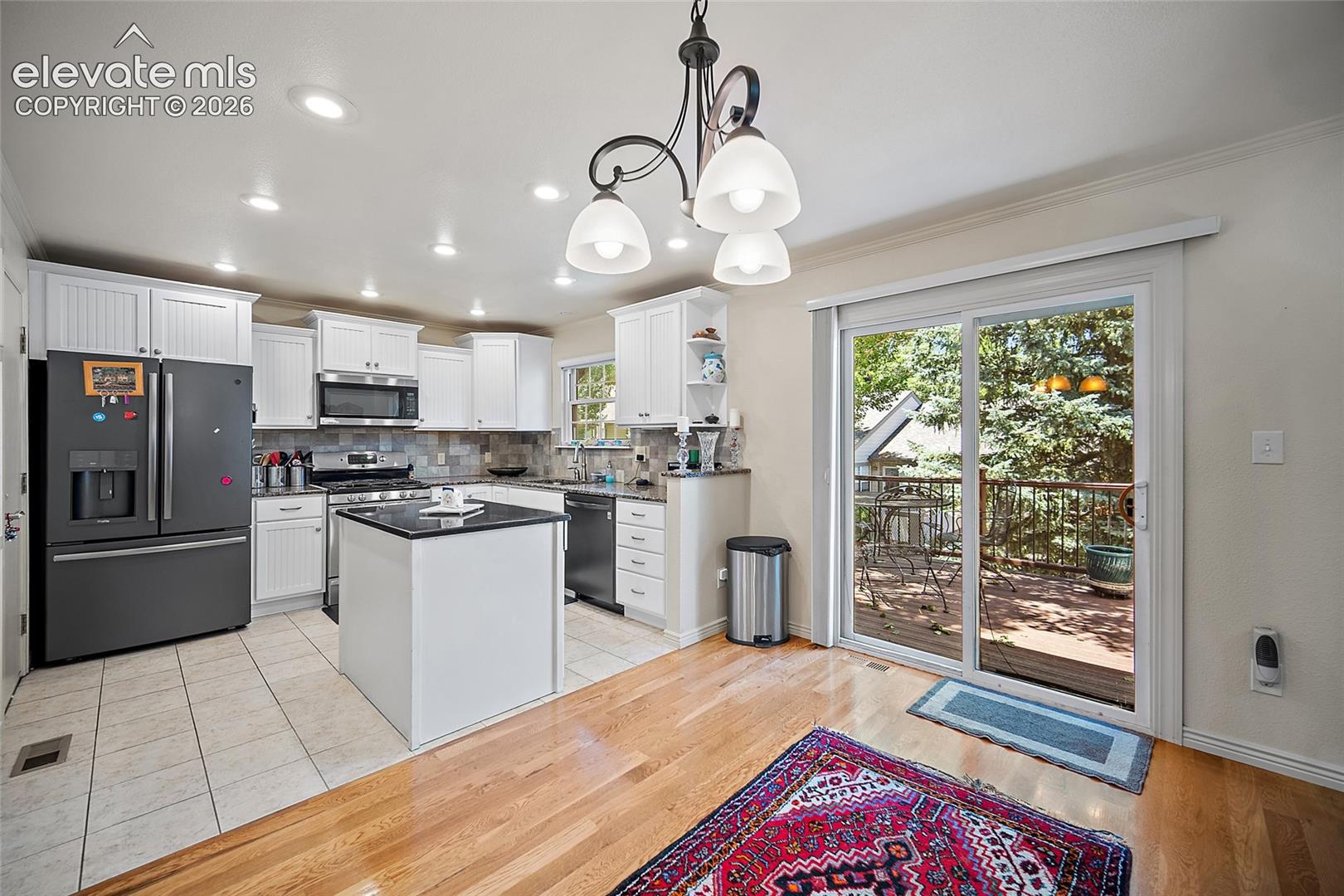 Granite counter tops with Gas cooktop and walk out to the large deck.