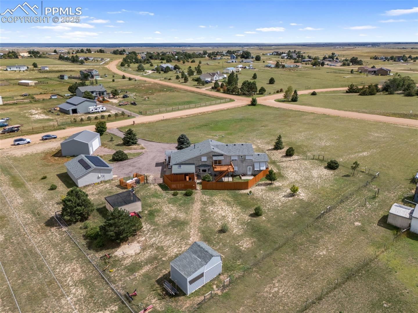 Property overview showcasing acreage and outbuildings