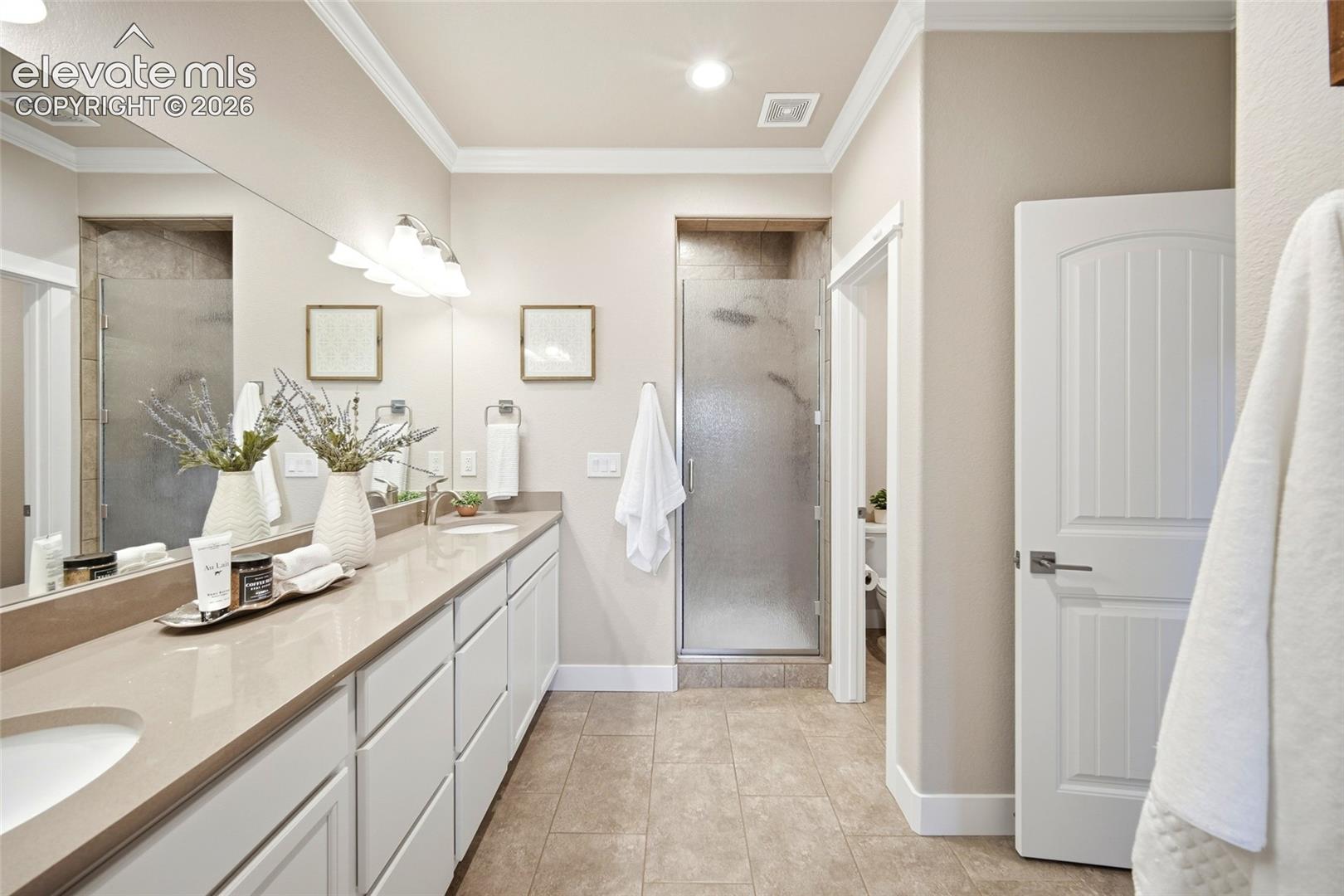 Primary bath with walk-in tiled shower