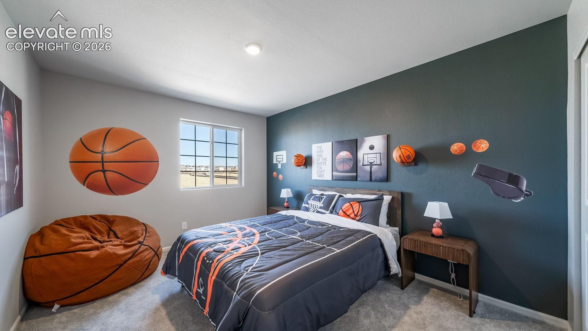 Bedroom featuring a multi-pane window, recessed lighting, and soft carpet flooring
Photos of a model home