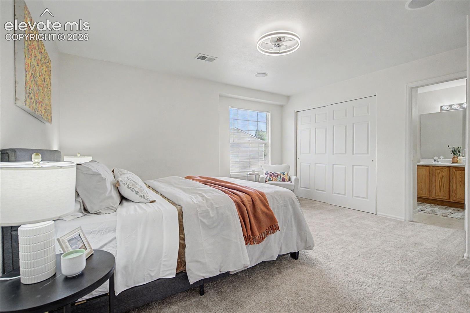 Bright Primary Bedroom with Large Window