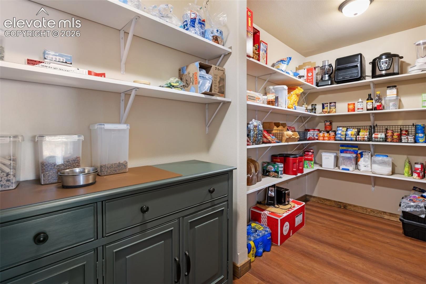 Pantry space with storage and daily use cabinets. 