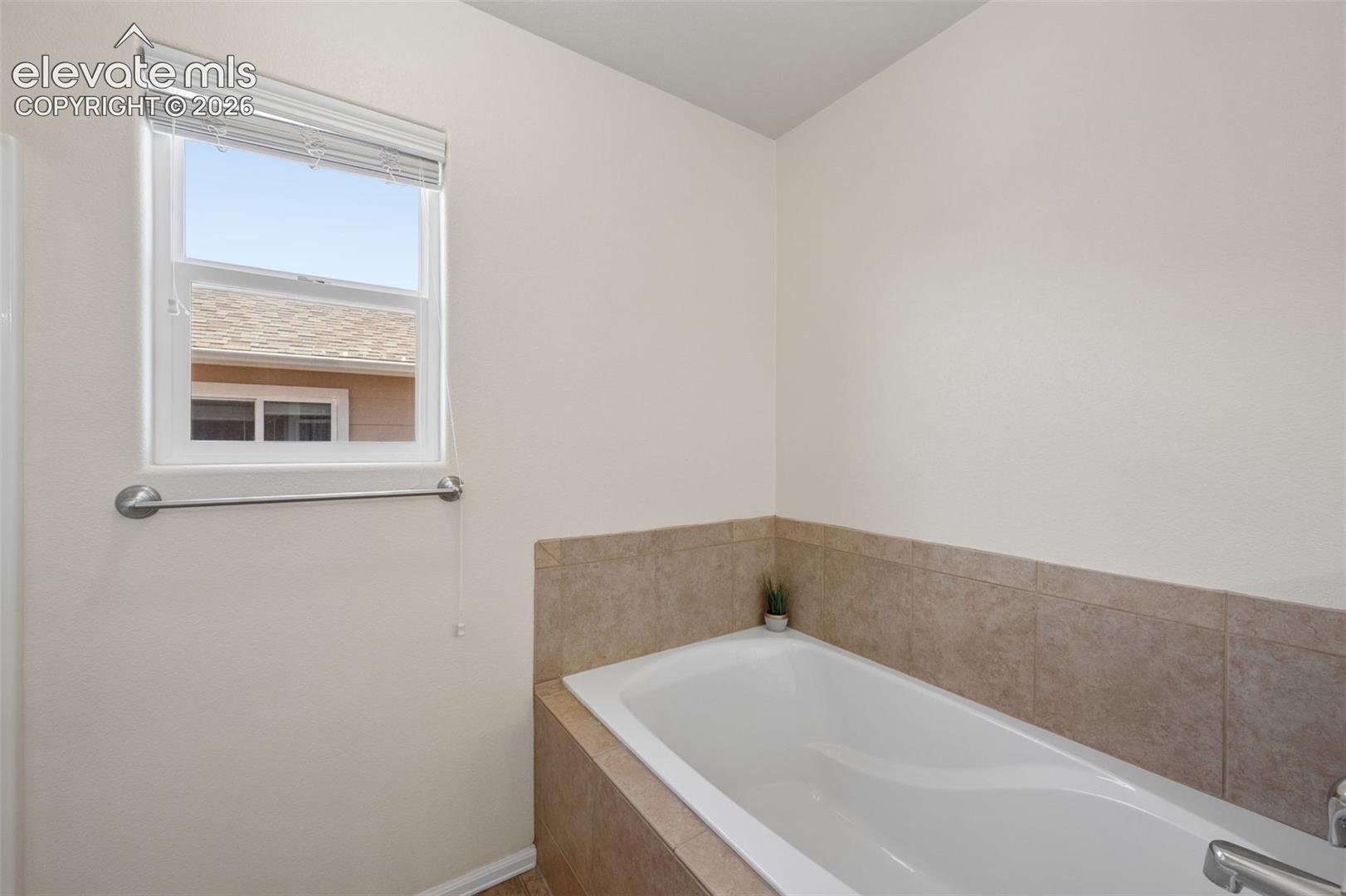 Primary Bedroom En-suite Soaking Tub and Stand Alone Shower