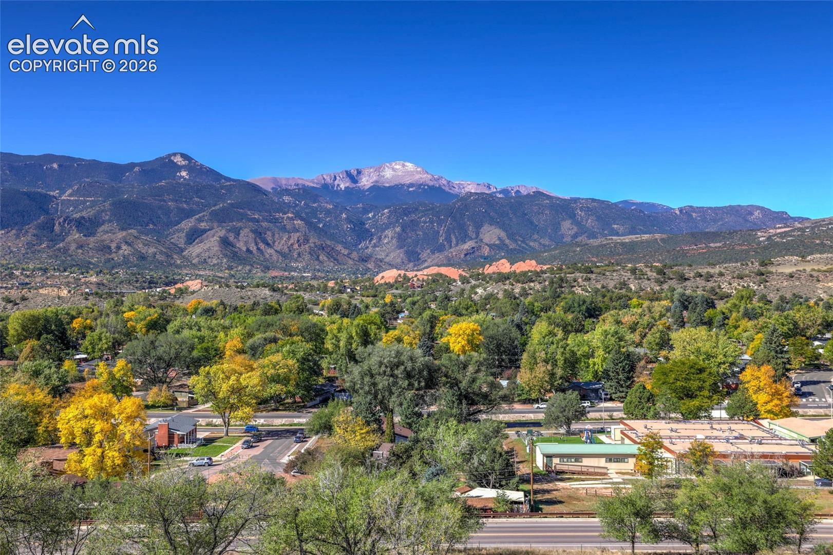Panoramic scenery featuring mountain ranges and extensive forest canopy