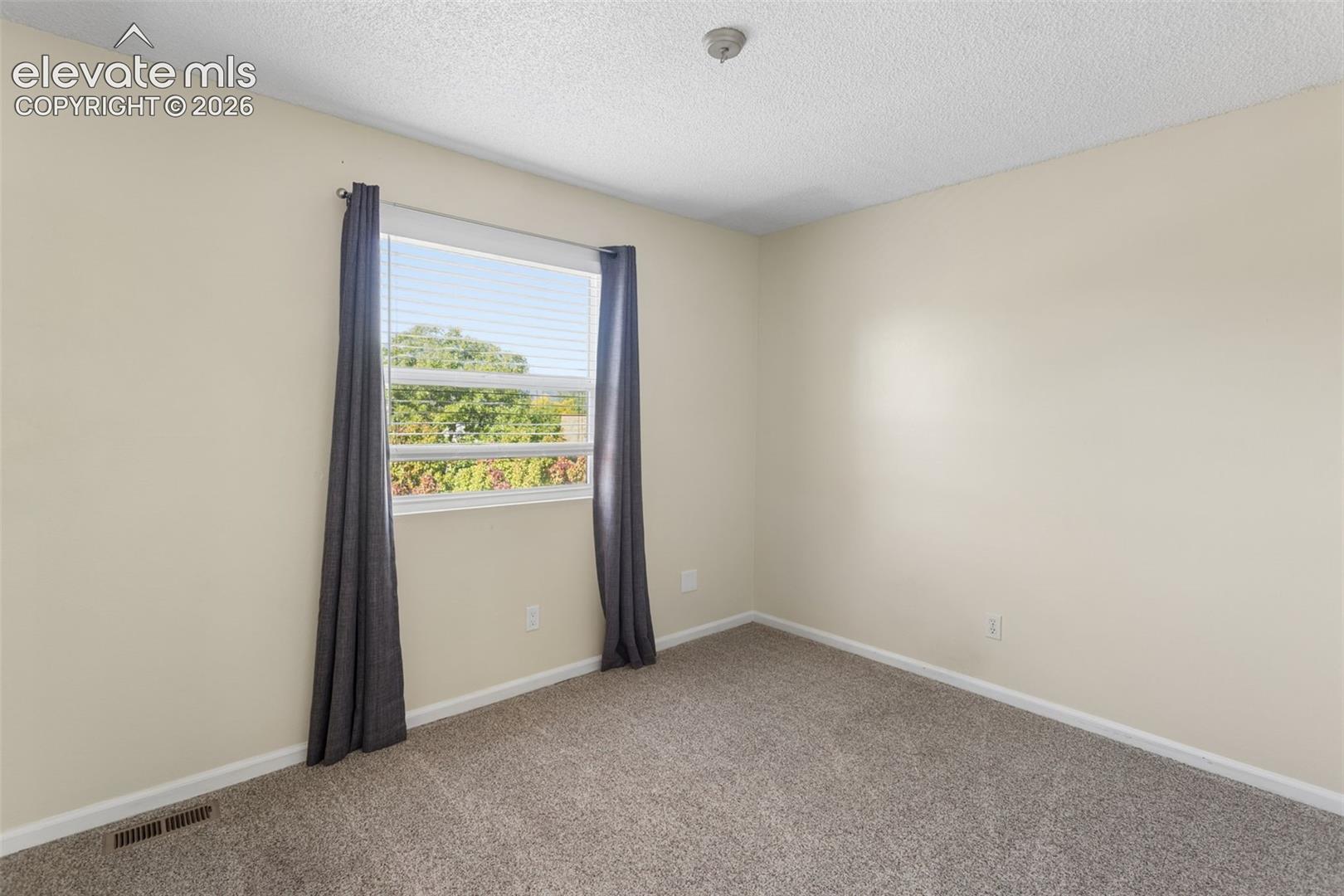 Bedroom two with carpet