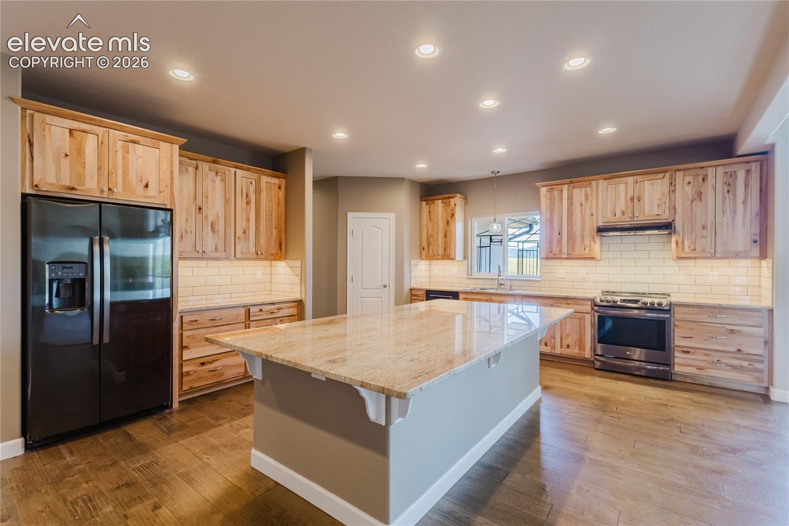 Check out the knotty pine and beautiful granite. 