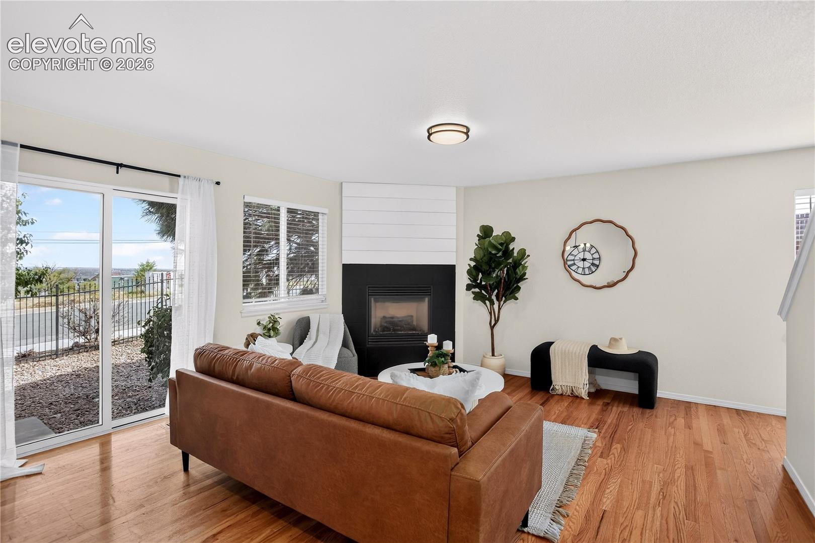 Living room with gas fireplace and walk out to back yard. 