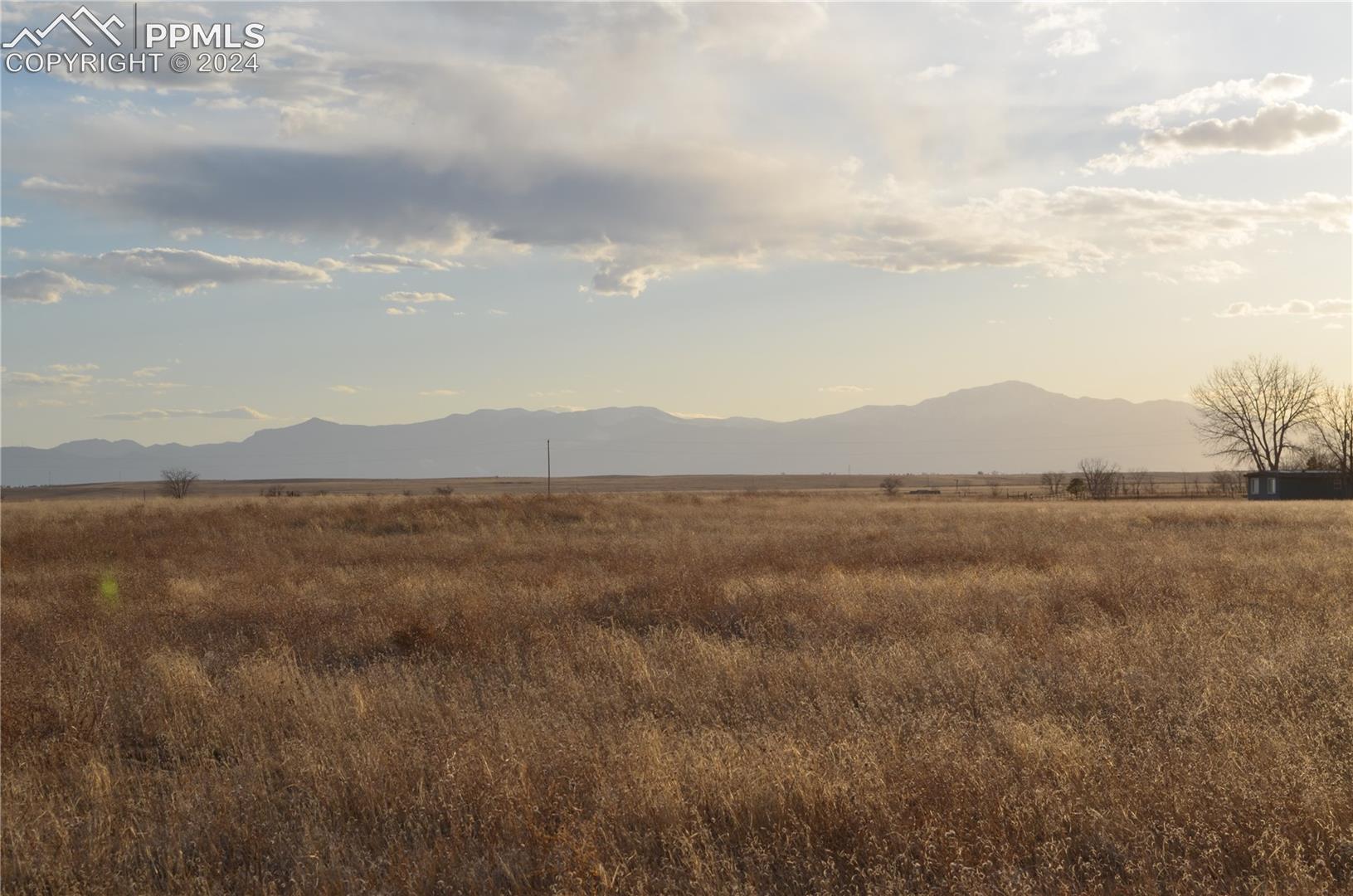 Property view of mountains with a rural view