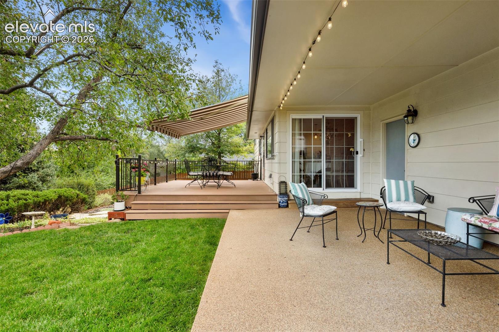 Secluded backyard with covered patio and deck for entertaining 