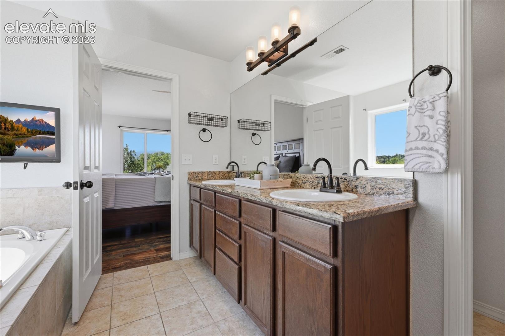 Spa like master bath retreat with granite counters!