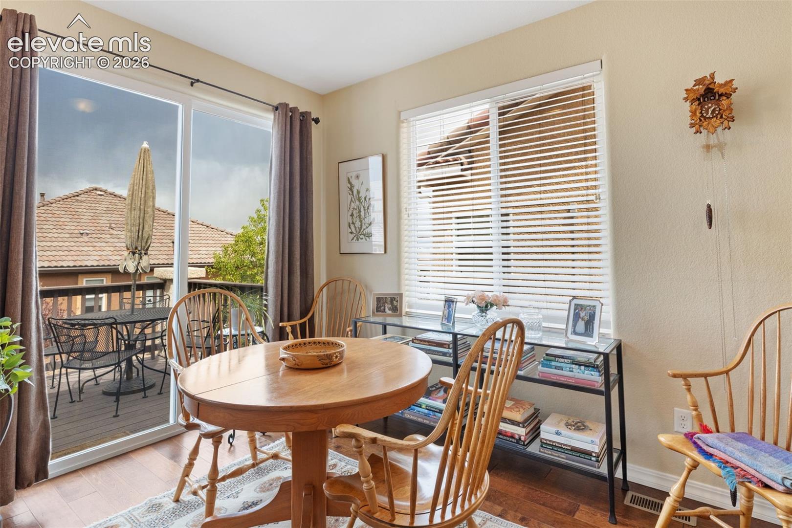 Sliding glass doors opening to an exterior deck.