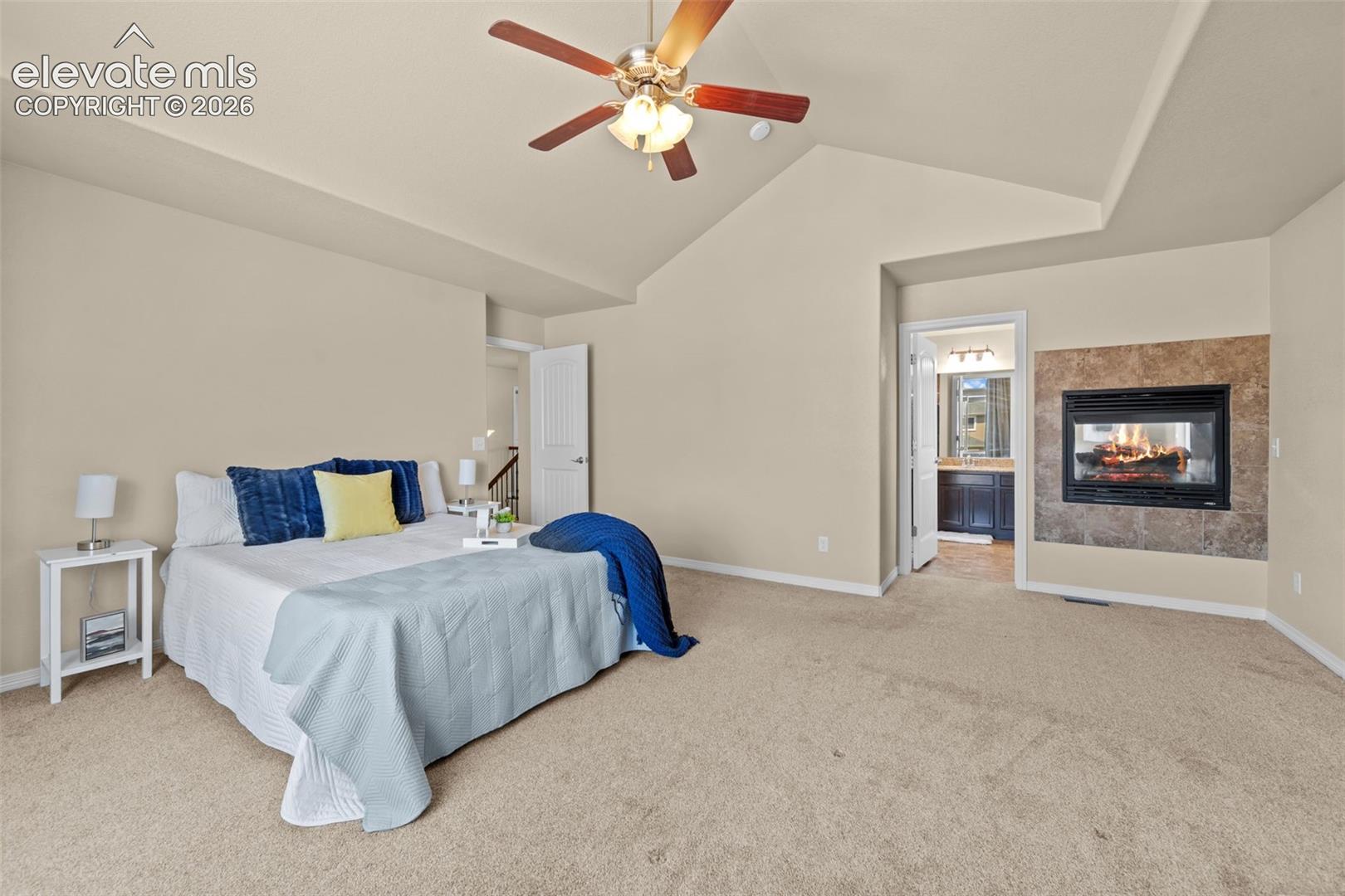 primary with double sided fireplace into tub area of bath