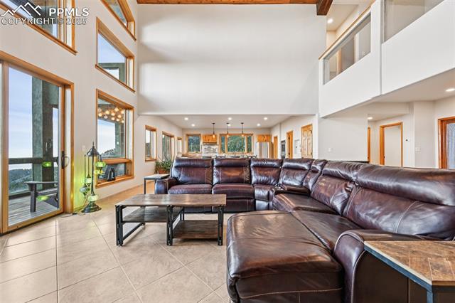 Open concept living room with wall of windows bringing in natural light and views!!!