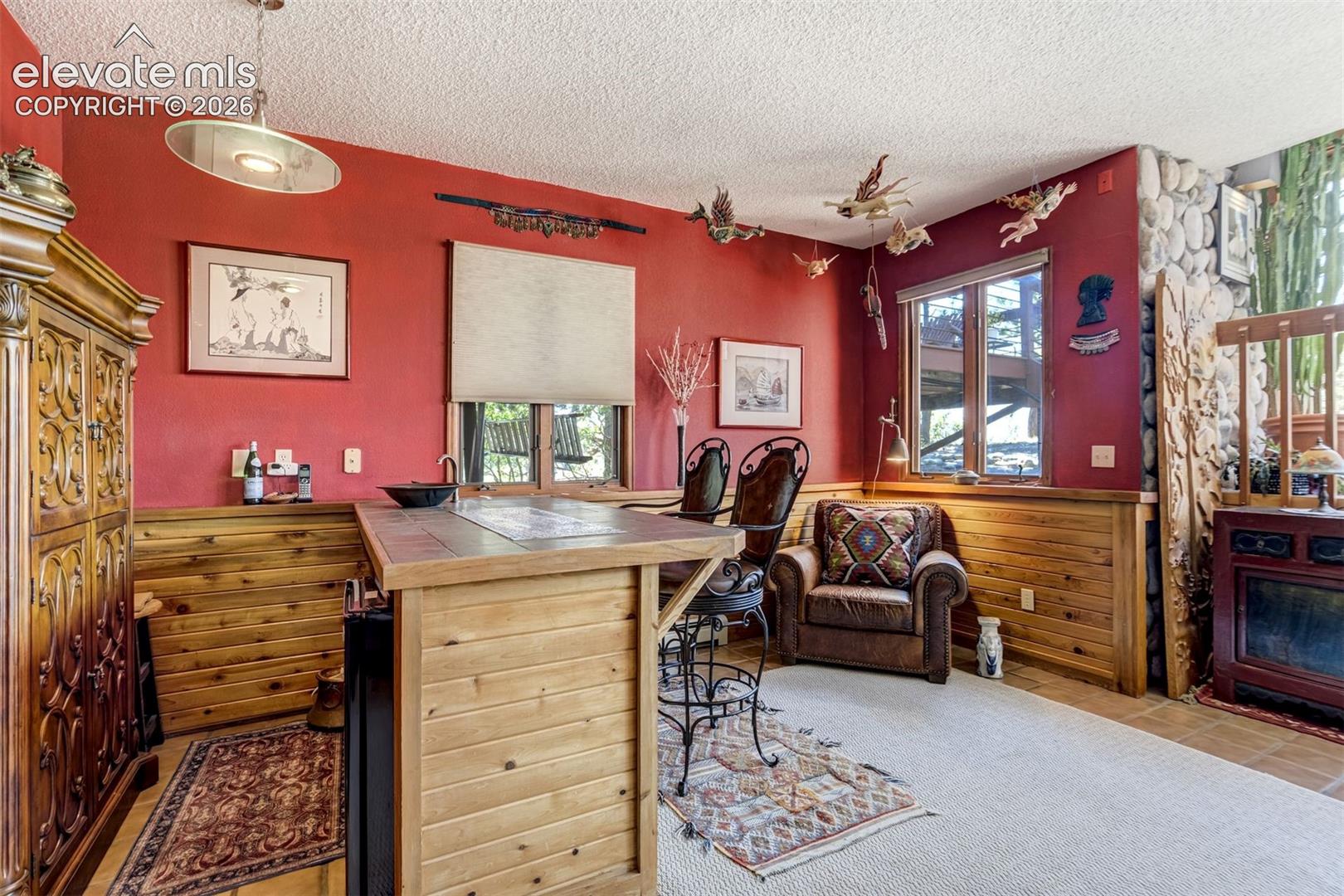 Family room in the basement has a wet bar with a Pankratz artist sink bowl.  