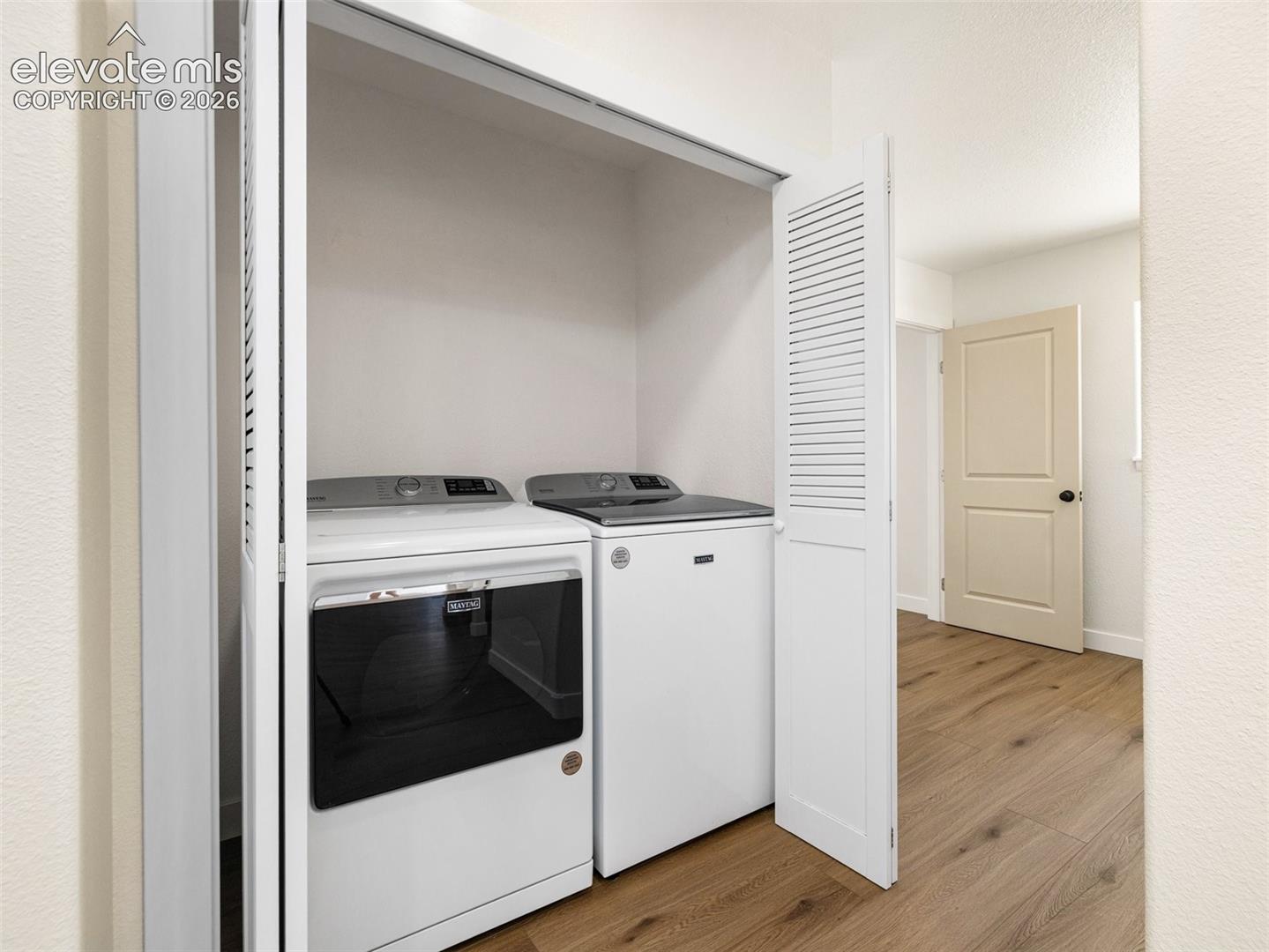This laundry space is off the living room in the ADU