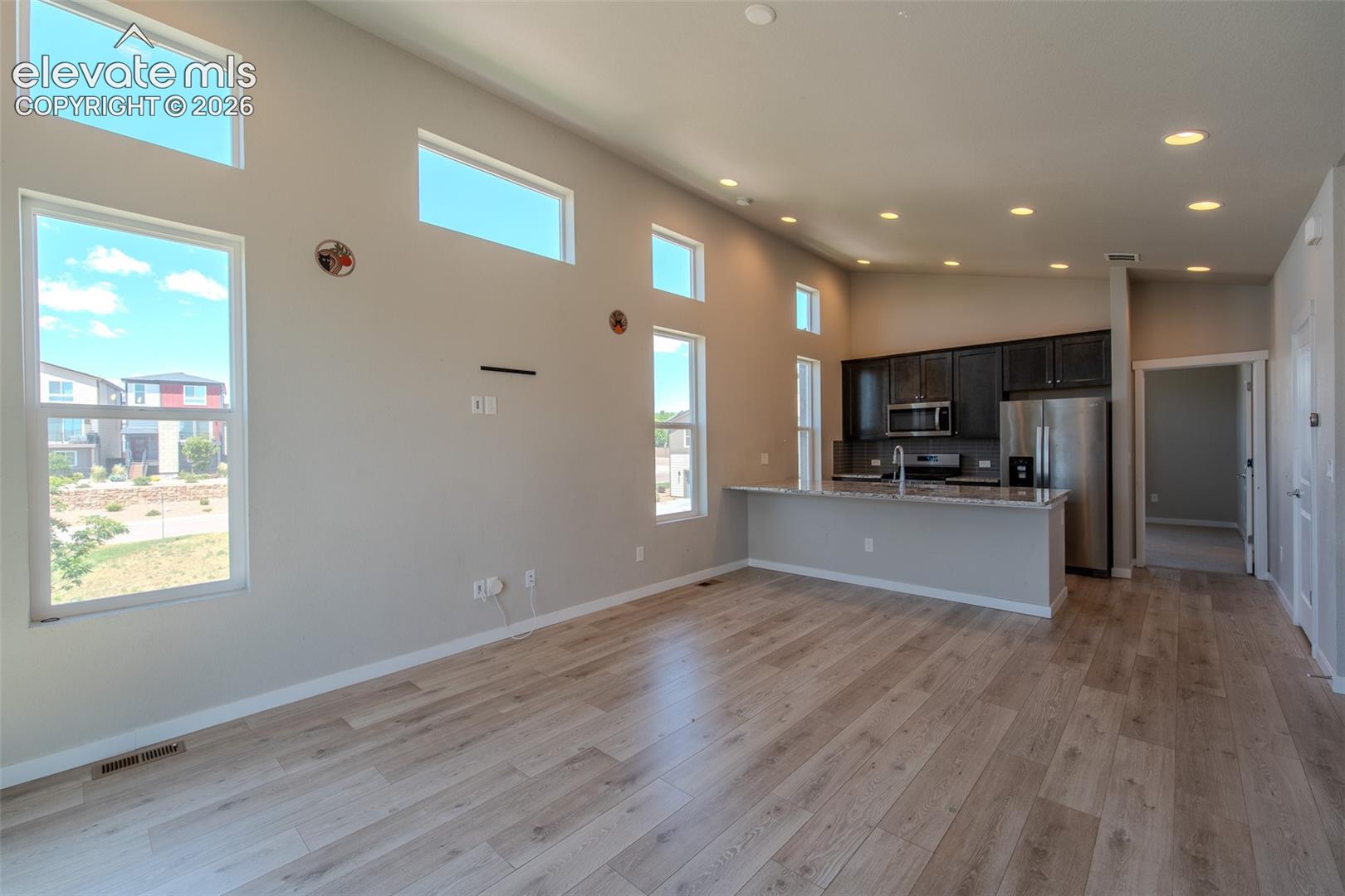 Lots of windows that flood the room with natural light.