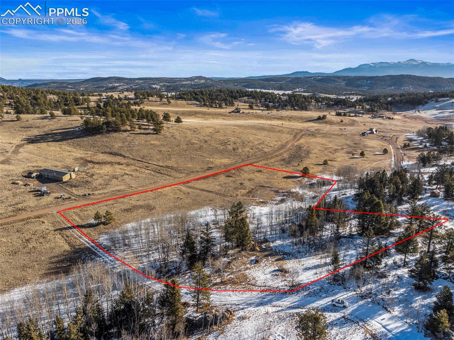 View of rural area featuring property boundaries highlighted and a mountain backdrop. Property Lines are Approximate and not a survey