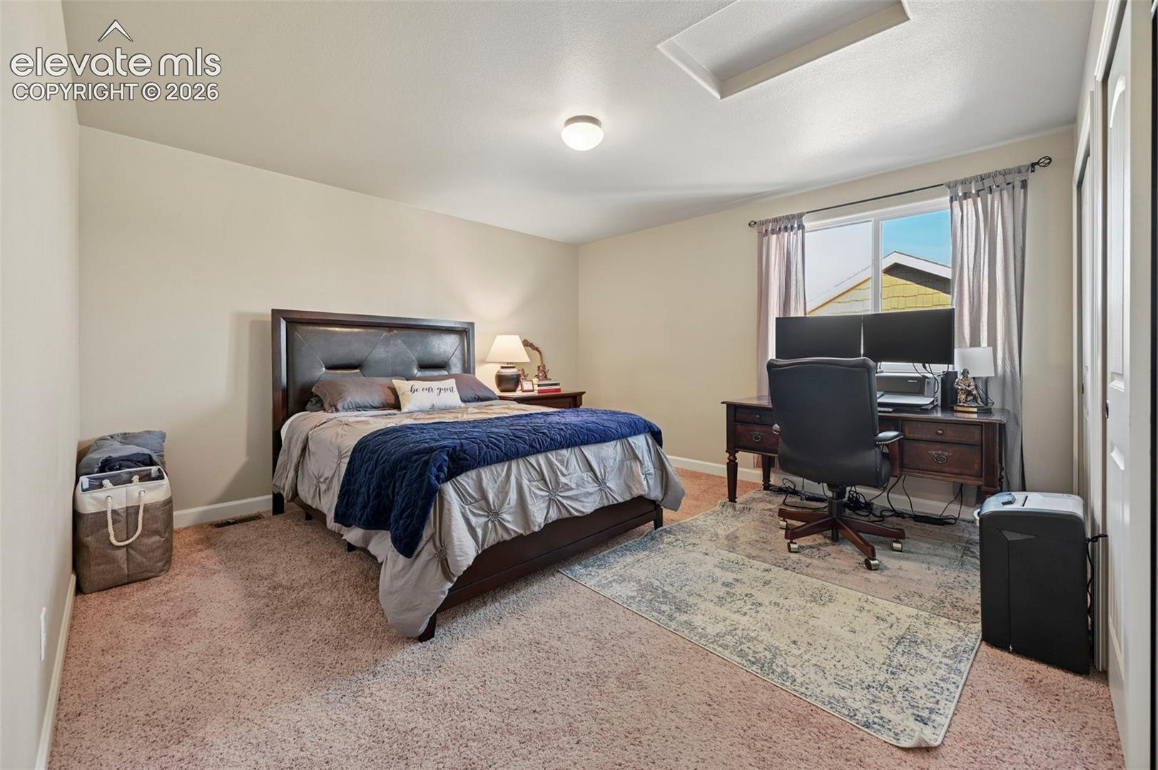 Neutral-toned walls and carpeted flooring