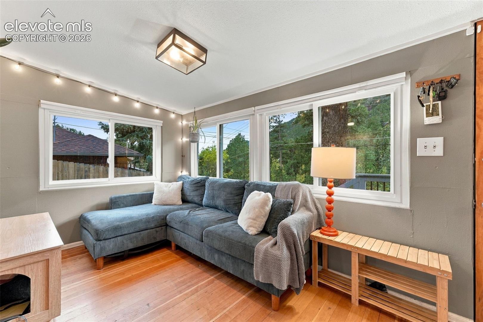 Family room space featuring large sliding windows.