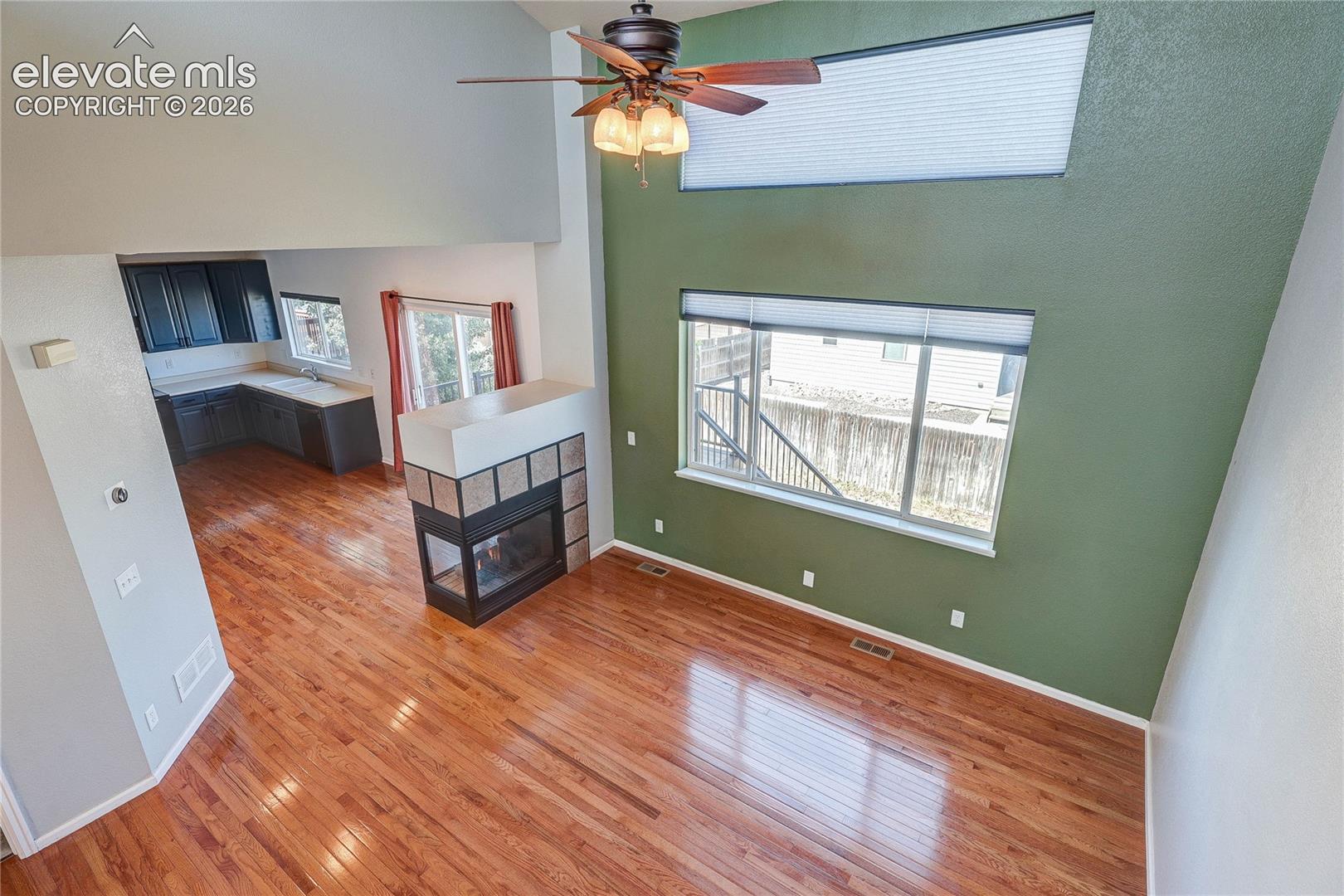 View of living room and kitchen from loft.