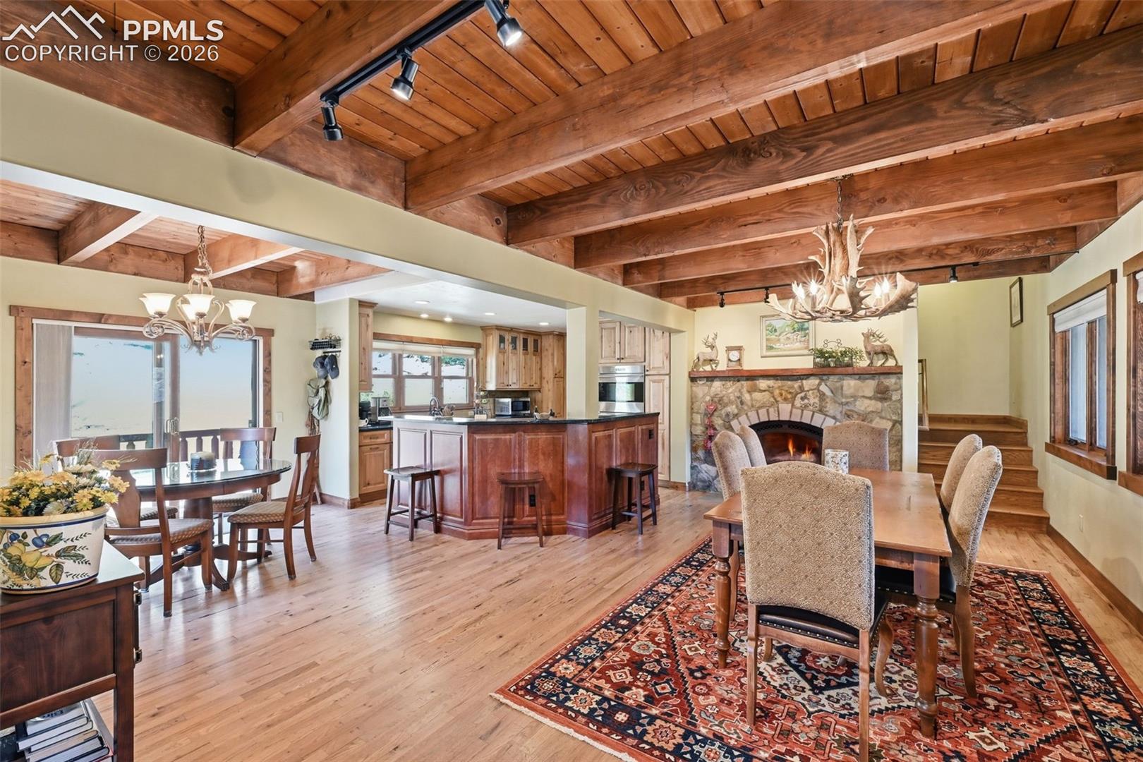 Two opposing fireplaces perfectly tie the living room, dining room and kitchen together, while providing stunning focal points for each area. This gas fireplace provides yet another way to heat the home on a chilly evening.  
