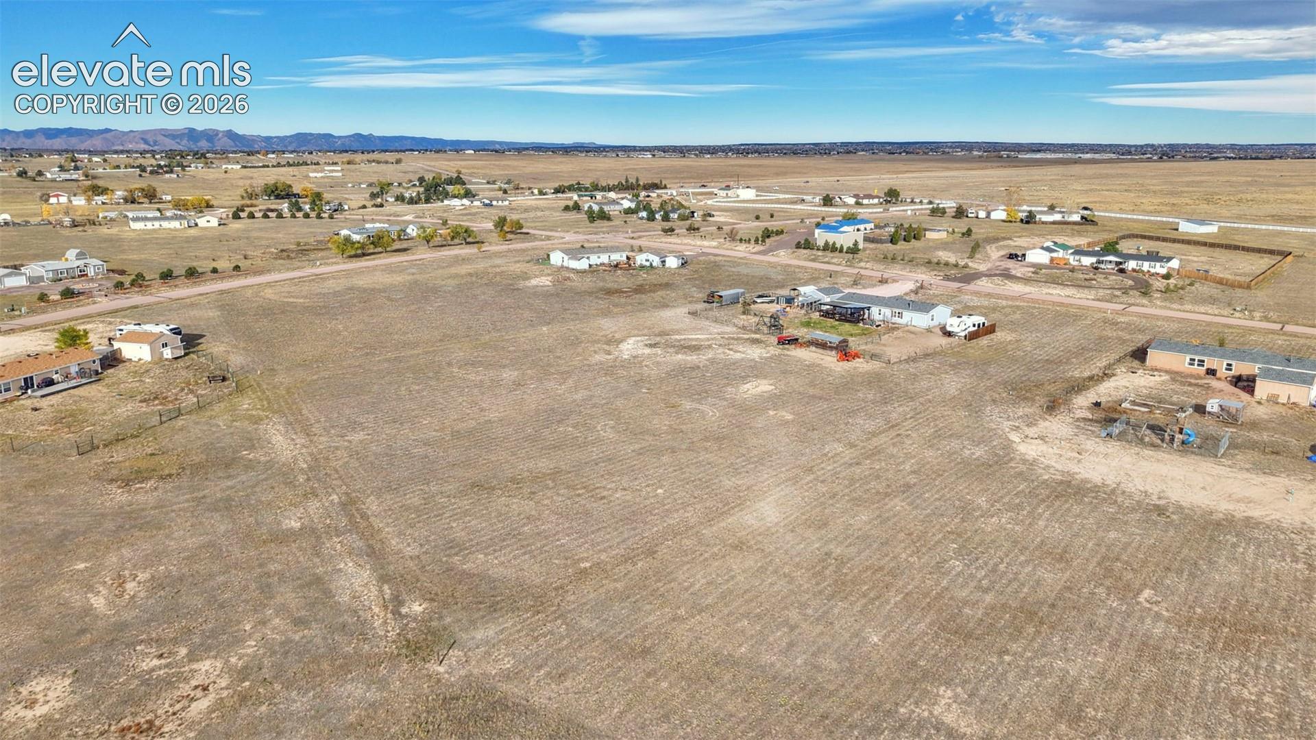 Expansive acreage featuring open terrain and distant mountain scenery
