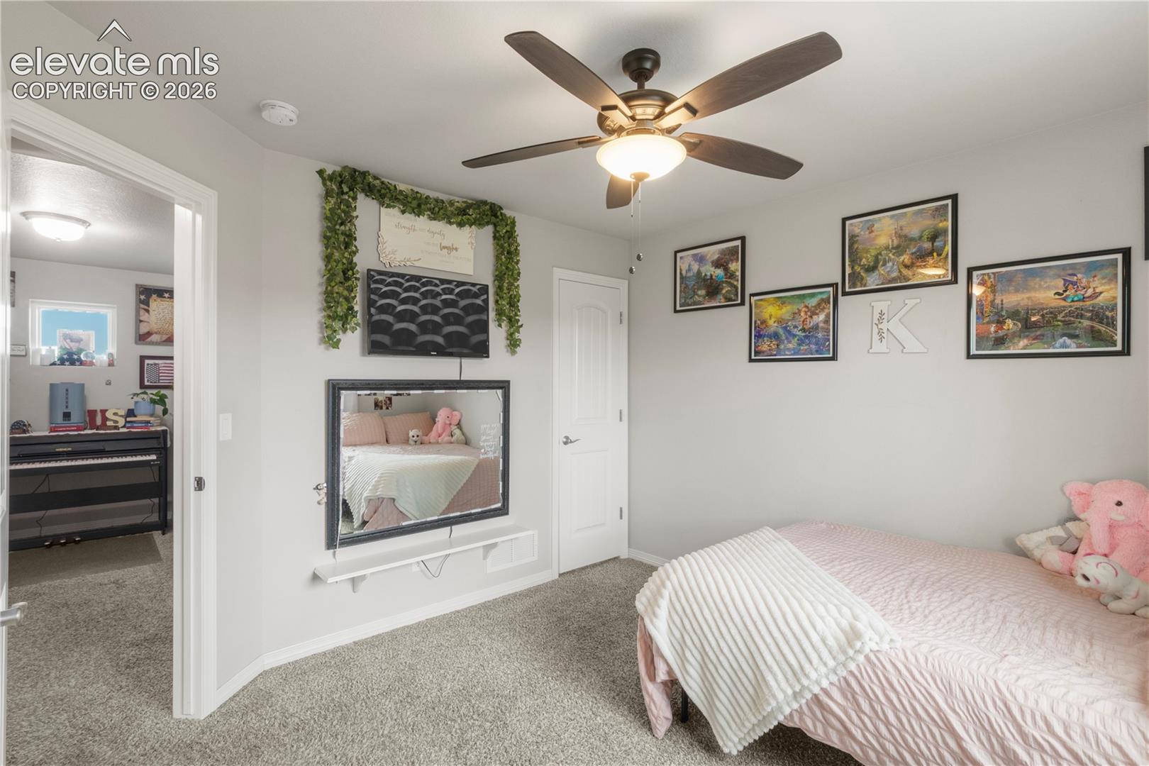 Gray wall paint and carpeted flooring