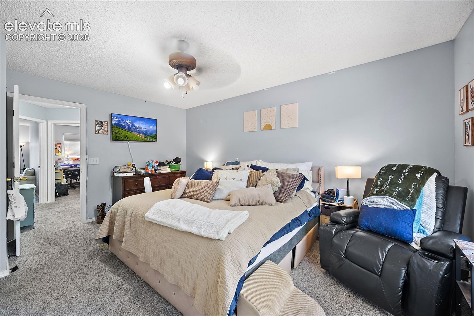 Recessed ceiling fan, light gray wall paint, and gray carpet flooring