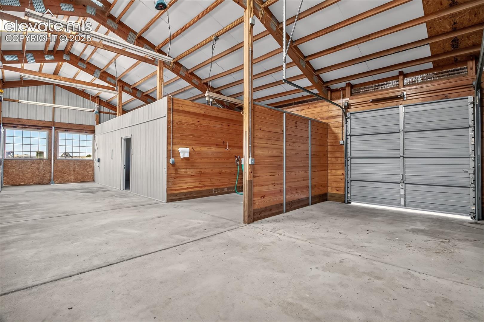 Overhead Hay Delivery Door, Wash Bay, Caretakers Quarters