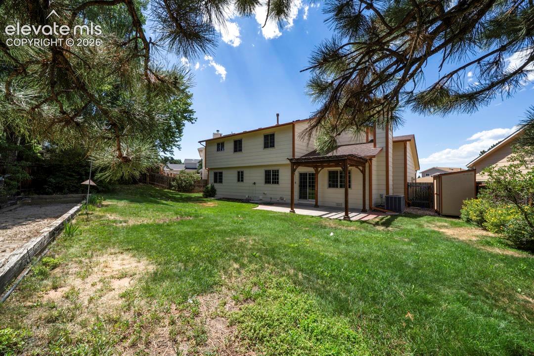 large back yard with 2 sheds