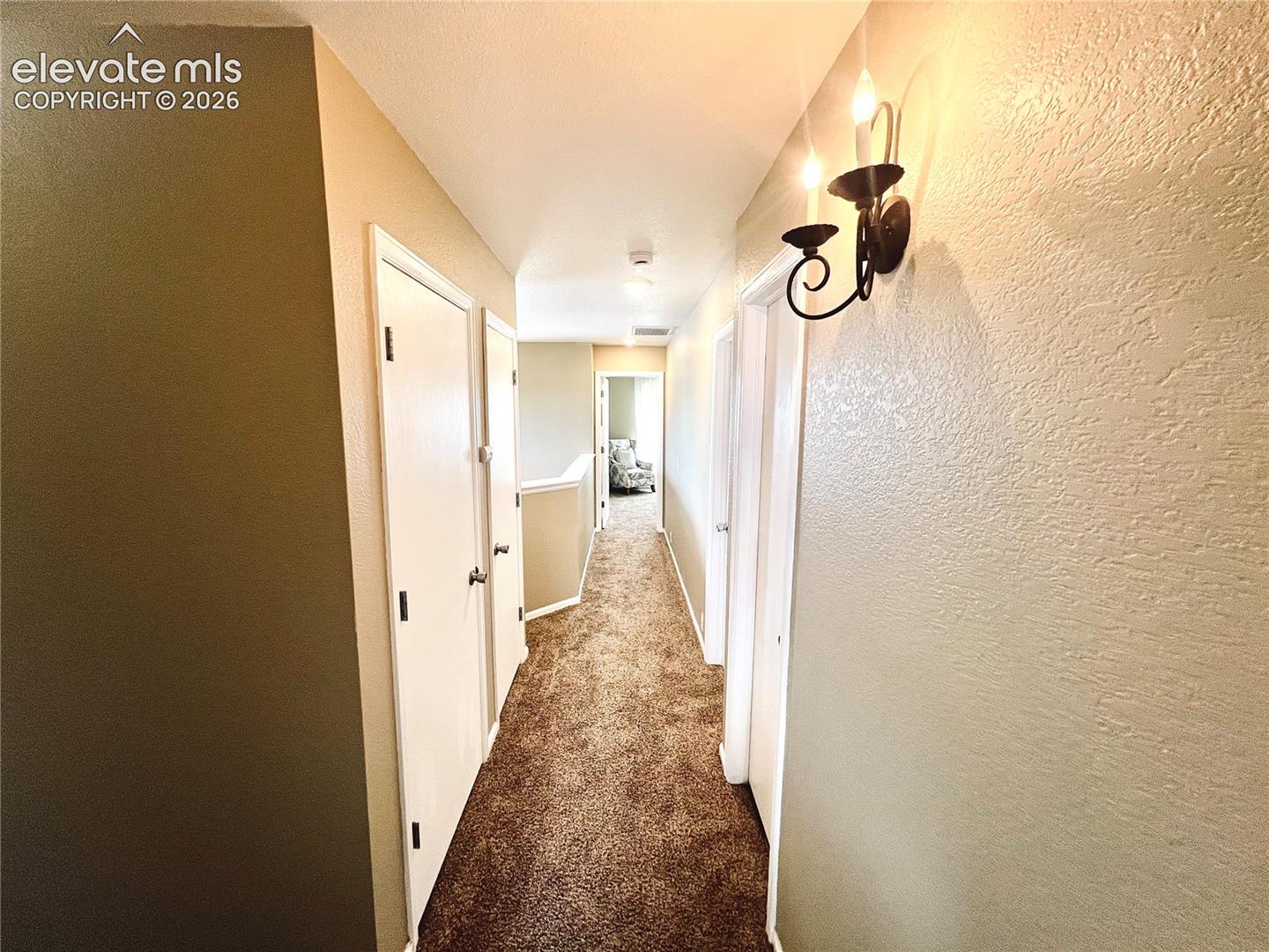 Upper level hallway, new carpets + flooring throughout the upper level, too!