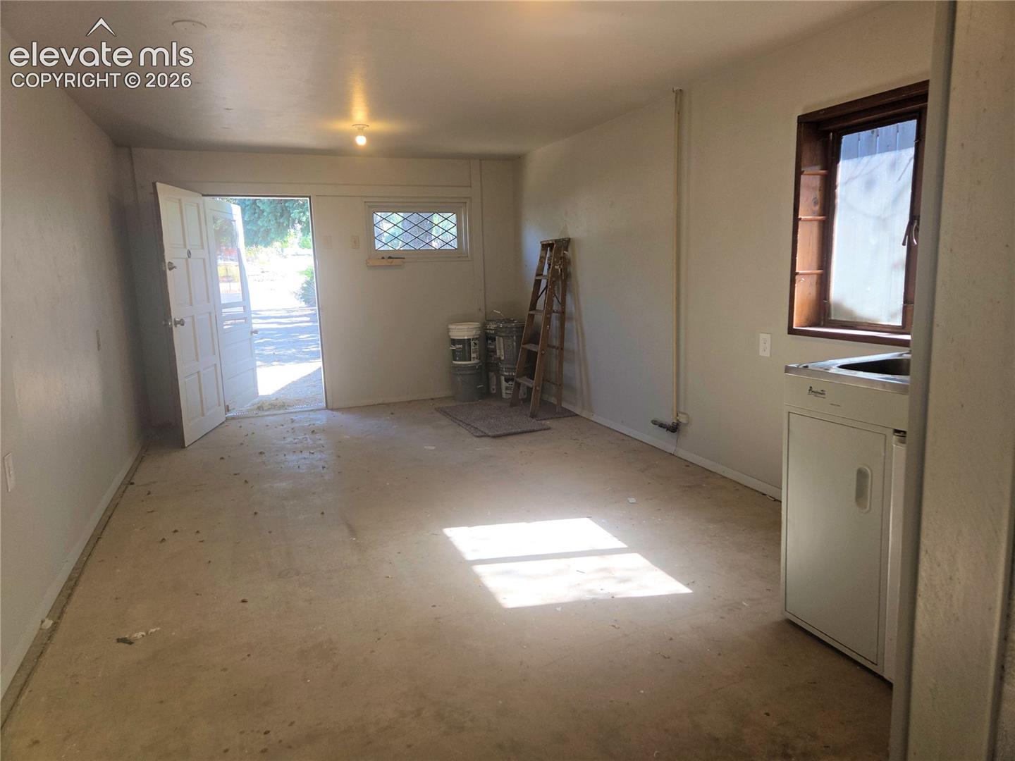 The other side of the hobby/library/flex space attached to the garage. Could be another living space if you finished it off. 