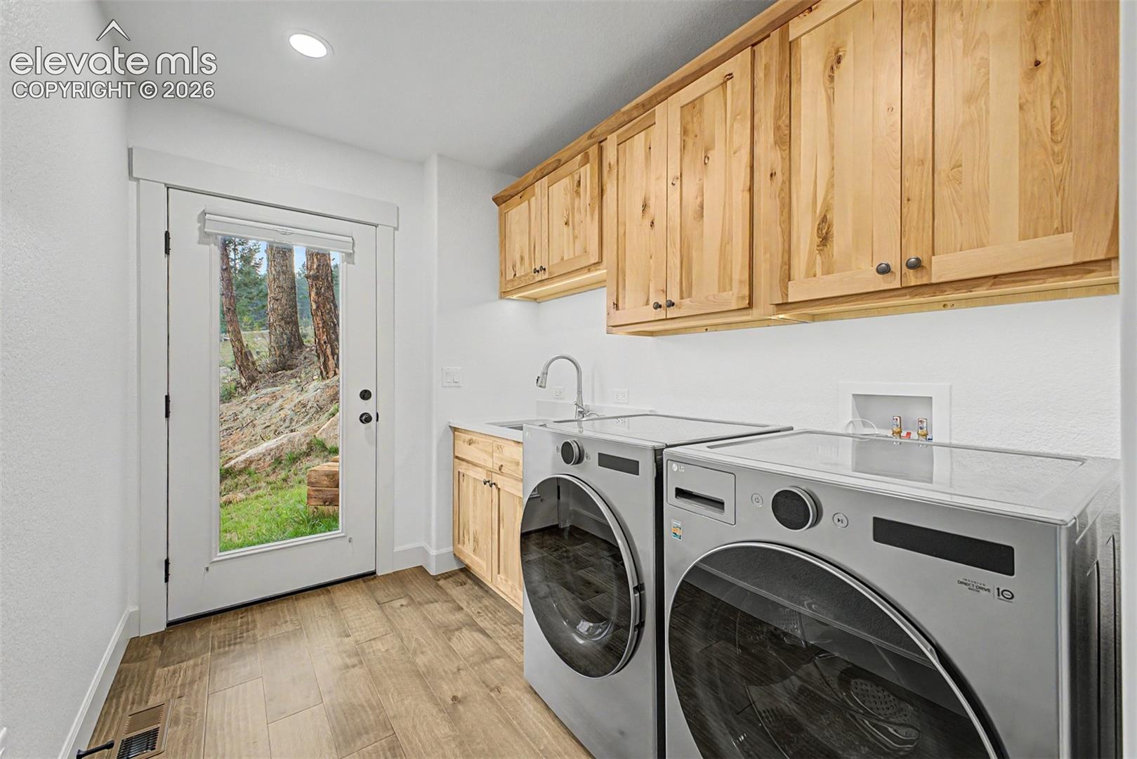 Main level laundry, with exit to side yard