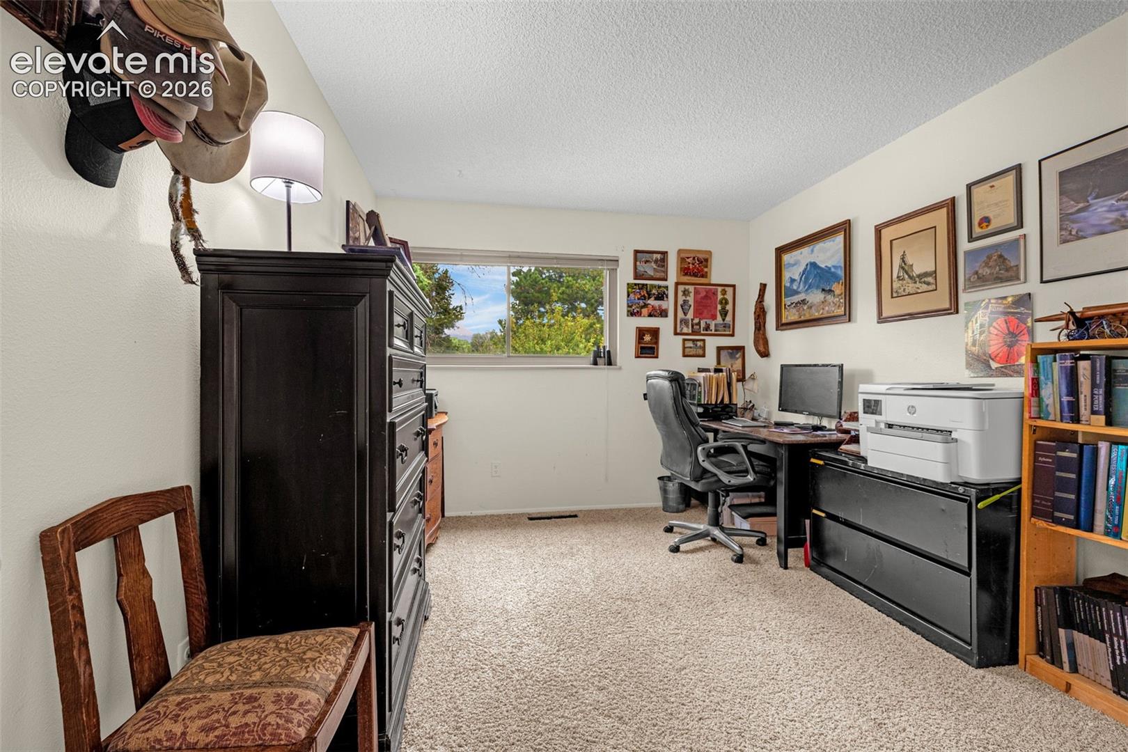 Bedroom 3- currently being used as office, with furniture 