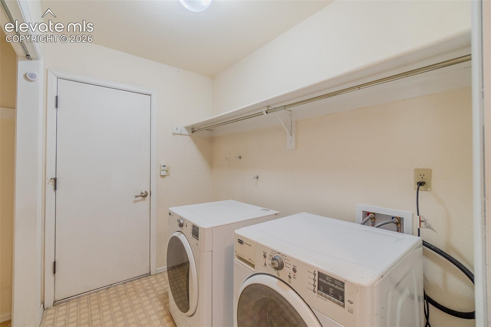 Main level laundry room with access to the garage. 
