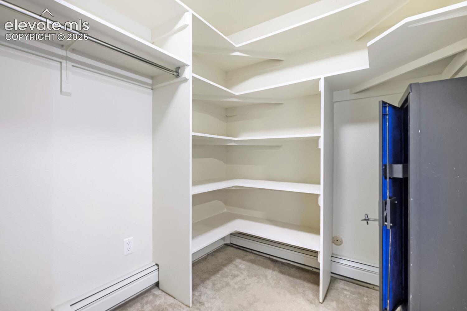 Custom closet system with built-in shelving and hanging rod