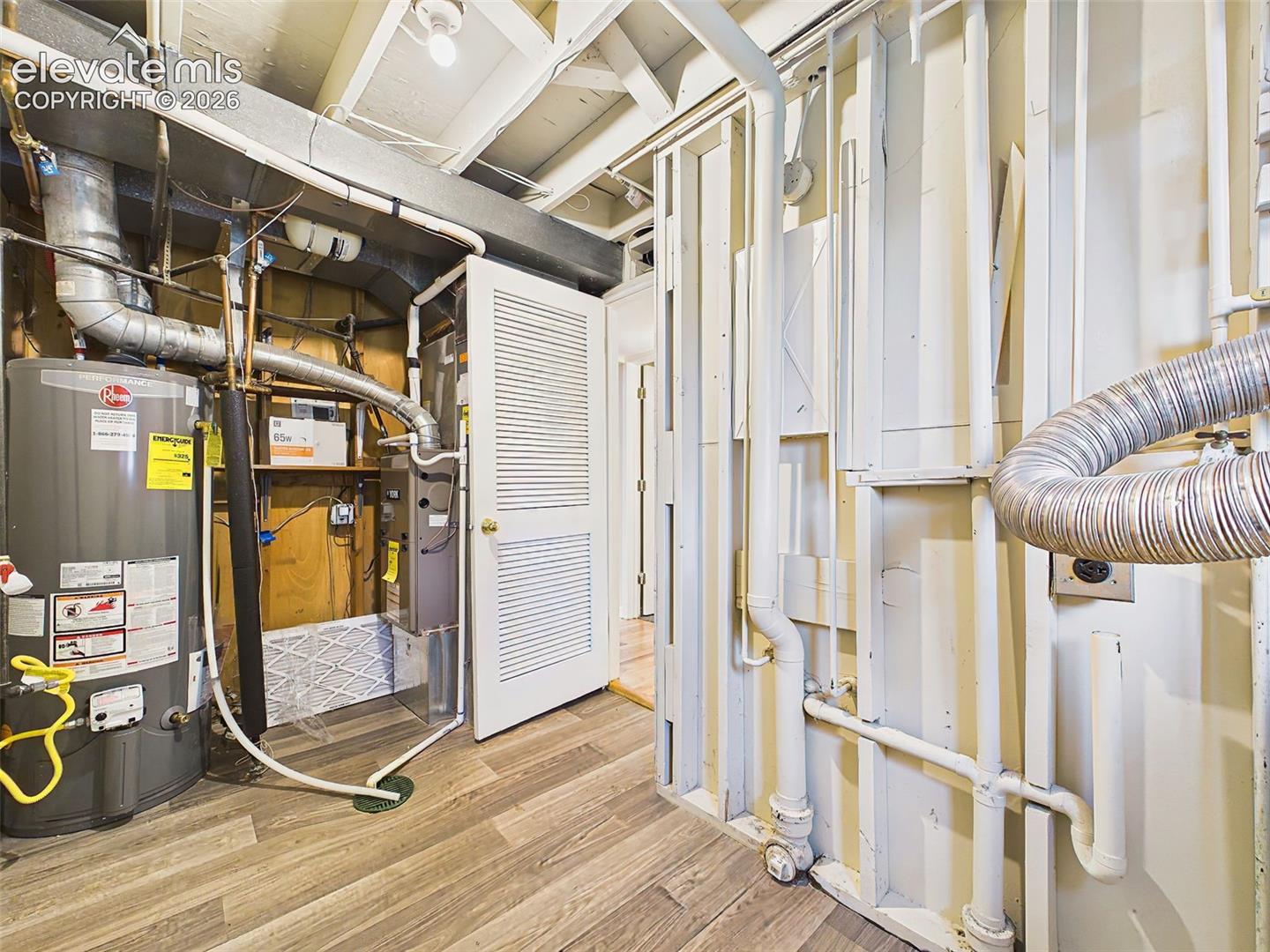 Dedicated utility room housing the mechanical systems, offering easy access and washer and dryer area