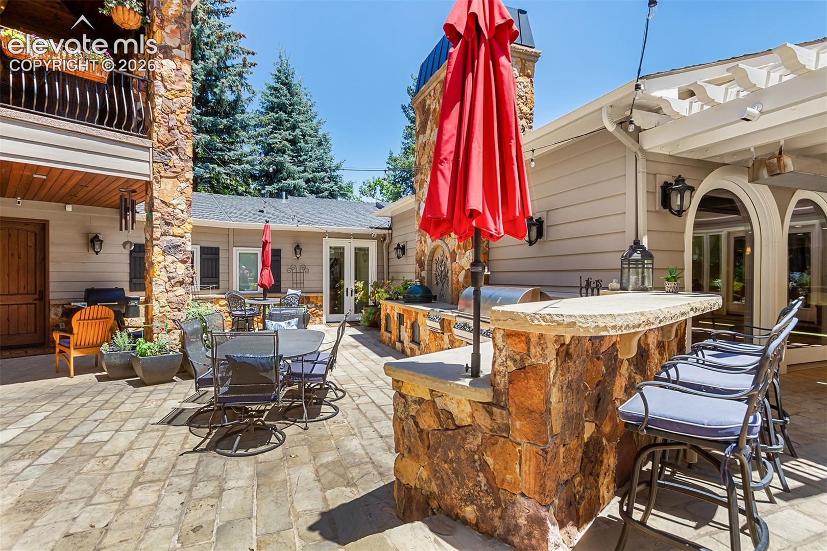 Large patio and grilling area for indoor/ outdoor entertaining.